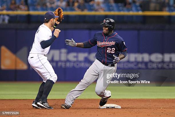 Minnesota Twins designated hitter Miguel Sano nearly collides with Tampa Bay Rays third baseman Evan Longoria as he rounds 2nd base in the 3rd inning...