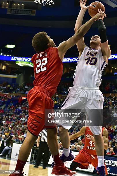 Northern Iowa forward Seth Tuttle shoots over Illinois State center Reggie Lynch in the first half during the championship game of the Missouri...