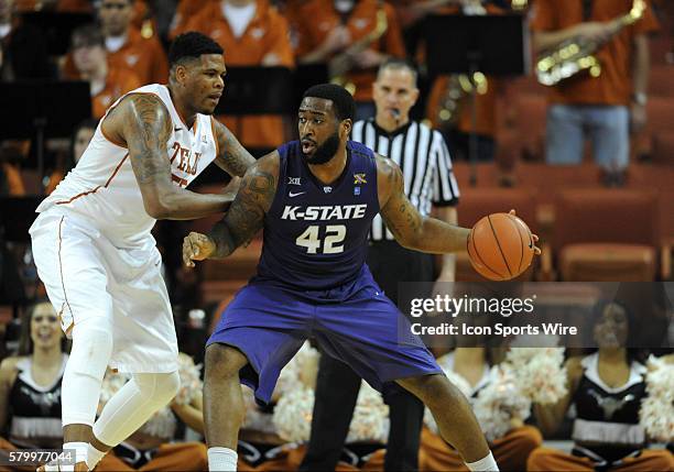 Kansas State forward Thomas Gipson is defended by Cameron Ridley during 62 - 49 loss to the Texas Longhorns at the Frank Erwin Center in Austin, TX.