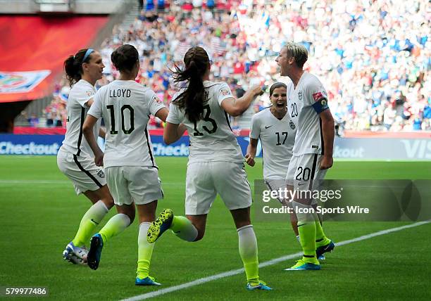 United States forward Abby Wambach is congratulated by teammates on a late first half goal that propelled the team past Nigeria on Tuesday at BC...