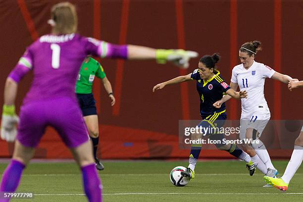 Colombia midfielder Diana Ospina and England midfielder Jade Moore fight for the ball during the 2015 FIFA Women's World Cup Group F match between...