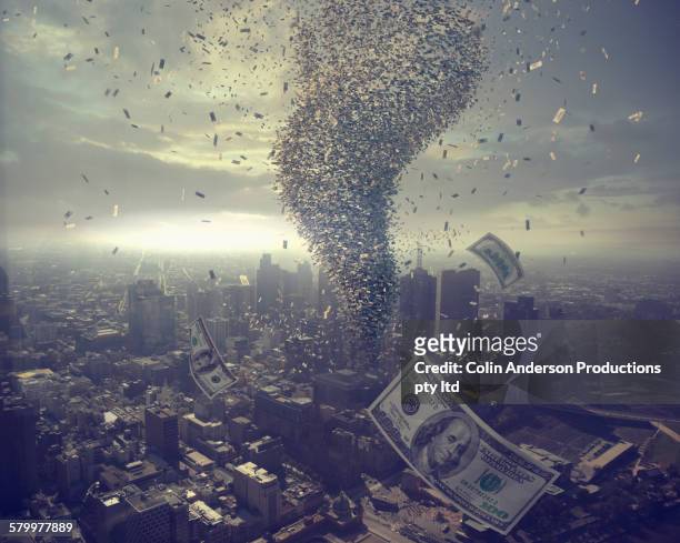 tornado of money over cityscape - the aftermath of hurricane maria amid an economic crisis stockfoto's en -beelden