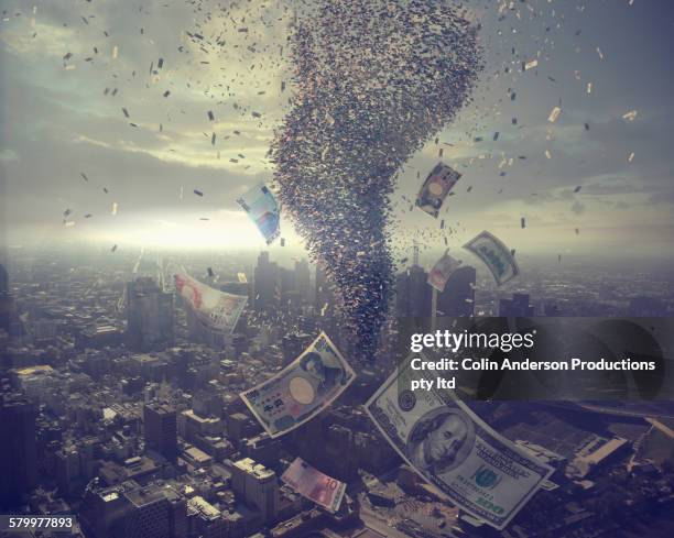 tornado of money over cityscape - viaggio distruzione foto e immagini stock