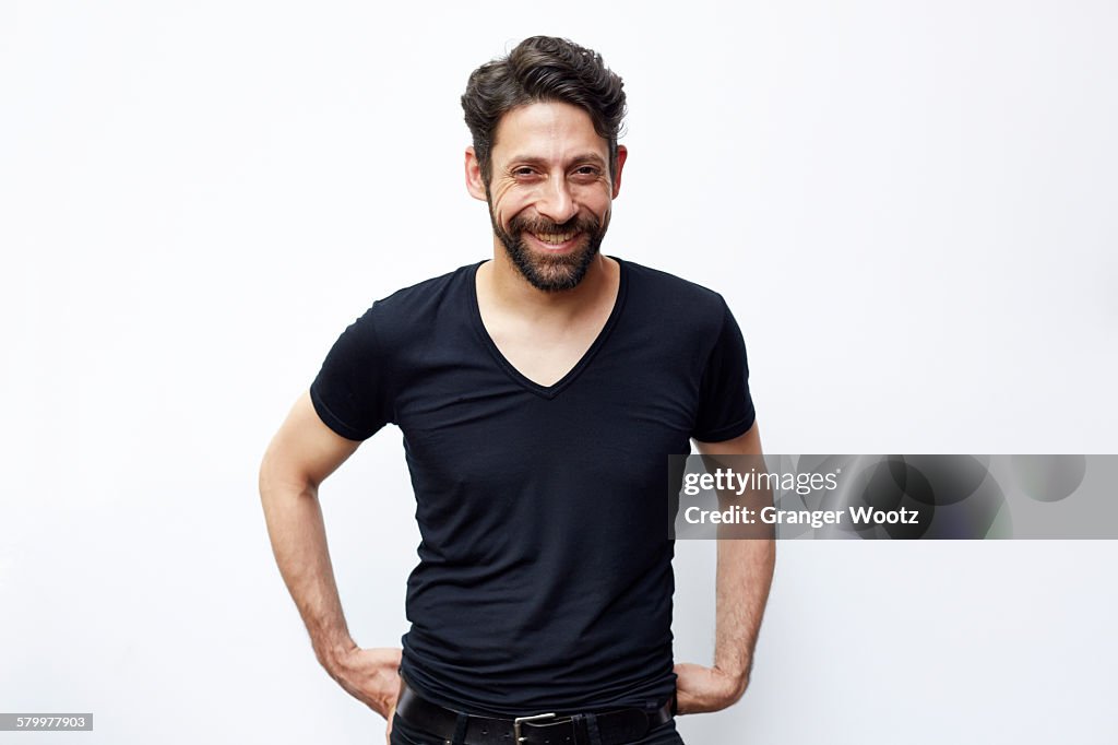 Caucasian man standing with hands on hips