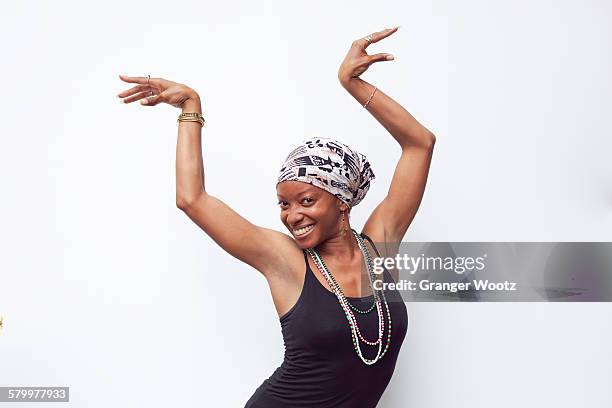 black woman posing with arms raised - vest stock pictures, royalty-free photos & images