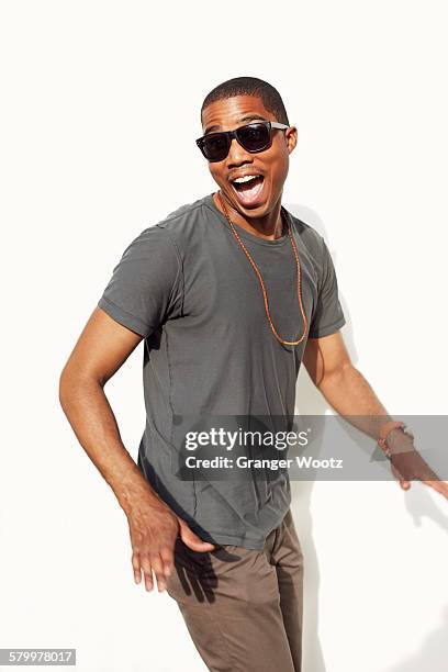 stylish man in sunglasses dancing - solo un uomo di età media foto e immagini stock