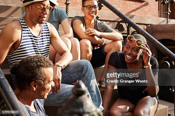 friends relaxing on front stoop - philippines friends stock pictures, royalty-free photos & images