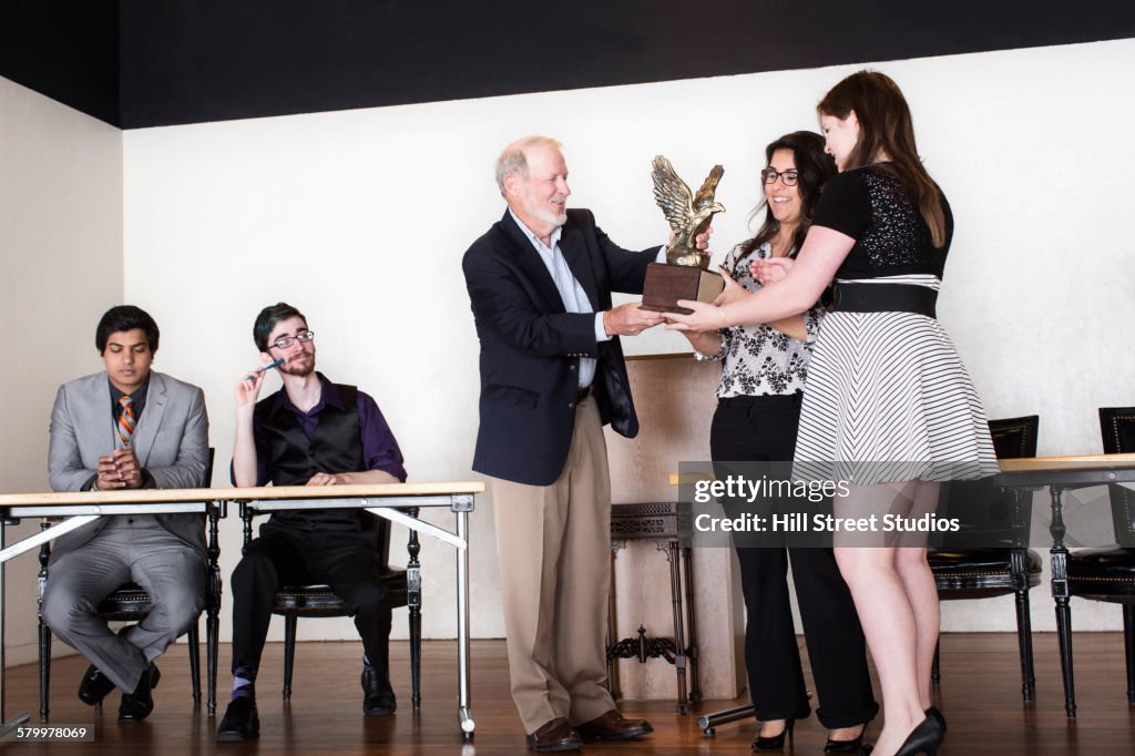 Debate Team Receiving Award On Stage High-Res Stock Photo - Getty Images