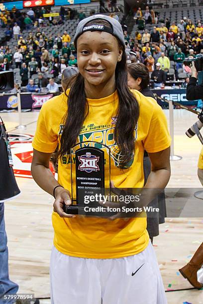 Baylor Bears forward Nina Davis is awarded the most outstanding player trophy after the NCAA Big 12 Women's basketball championship game between the...