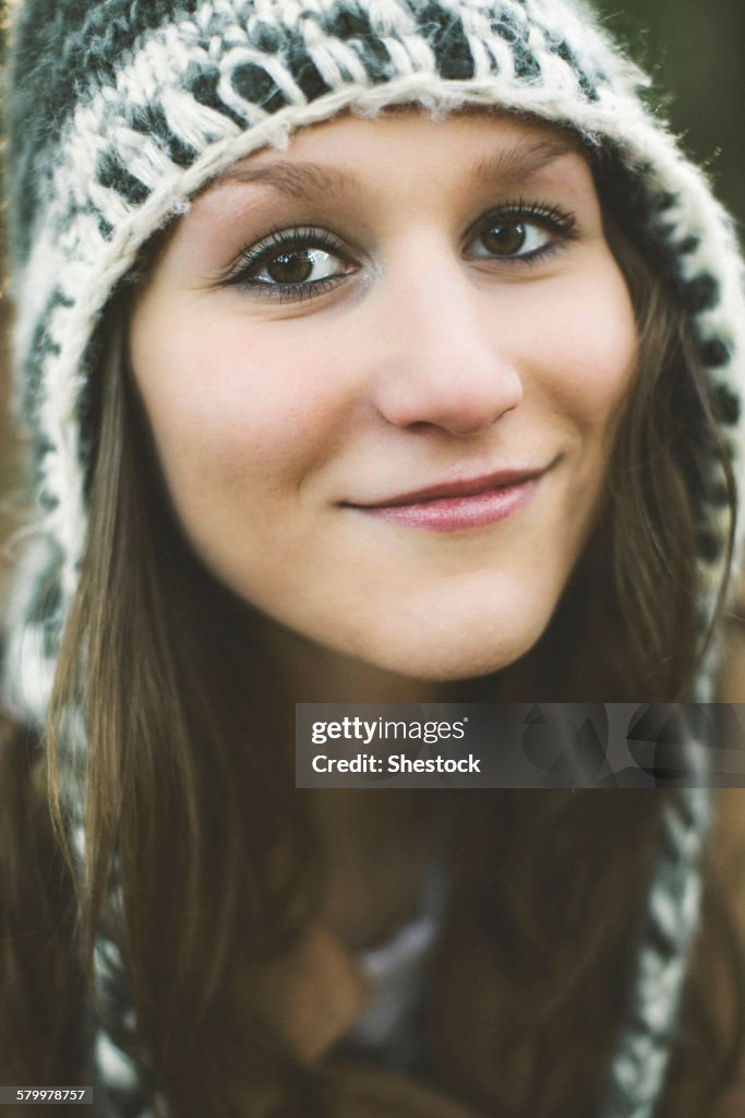 Close up of smiling Caucasian woman wearing knitted hat