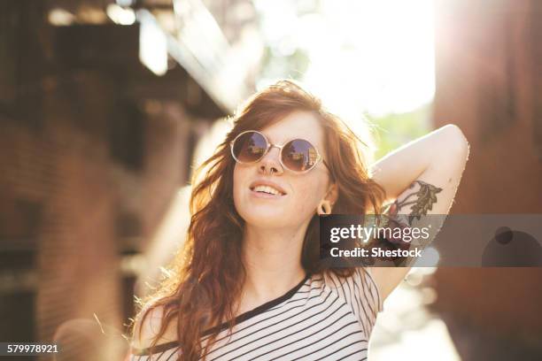 caucasian woman posing in city - boston women ストックフォトと画像