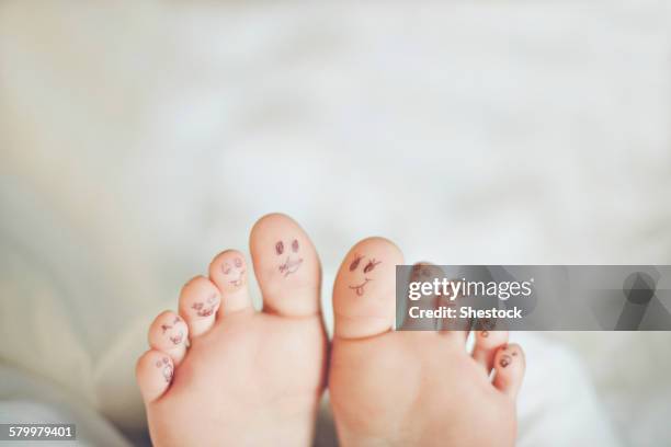 toes of caucasian girl with smiley face drawings - girl toes stock pictures, royalty-free photos & images