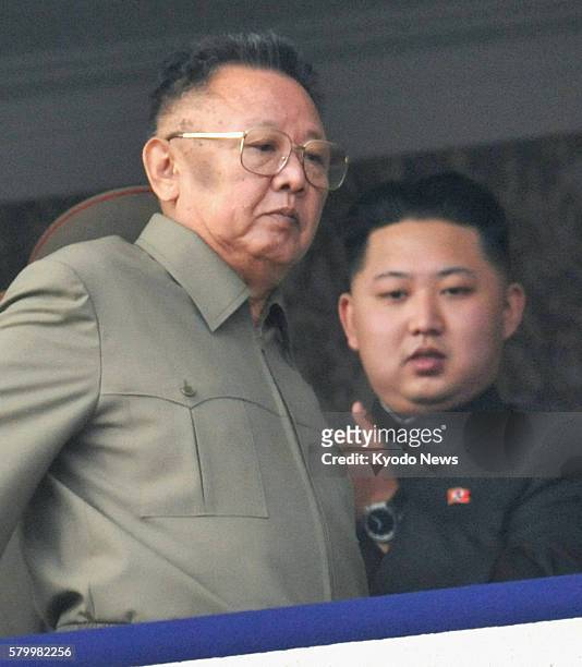 Pyongyang, North Korea - North Korean leader Kim Jong Il walks off after reviewing a military parade marking the 65th anniversary of the founding of...