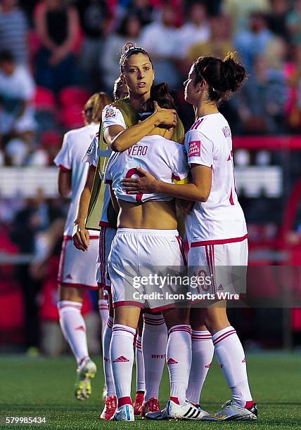 Veronica Boquete of Spain is consoled by team mates after Spain's 2-1 loss to Korea eliminating Spain from the FIFA 2015 Women's World Cup after...