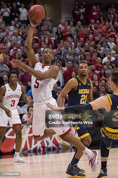 Indiana Hoosiers forward Troy Williams hits a shot while falling down during the men's Big Ten Tournament basketball game between the Michigan...