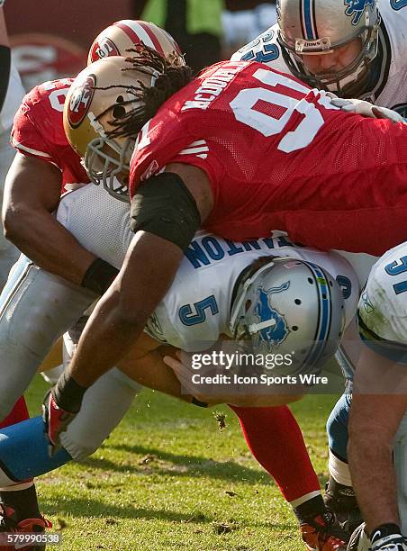 San Francisco 49ers defensive end Ray McDonald and safety Mark Roman sack Detroit Lions quarterback Drew Stanton on Sunday, December 27, 2009 at...