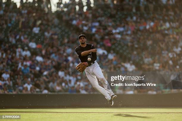 Colorado Rockies third baseman Nolan Arenado makes a defensive play during a regular season interleague Major League Baseball game between the...