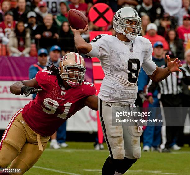 San Francisco 49ers defensive tackle Ray McDonald forces Oakland Raiders quarterback Jason Campbell to pass on Sunday, October 17, 2010 at...