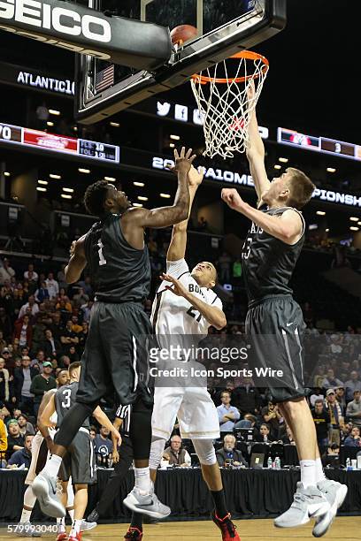 Davidson Wildcats forward Peyton Aldridge blocks a shot by St. Bonaventure Bonnies forward Dion Wright with just over three minutes remaining in...
