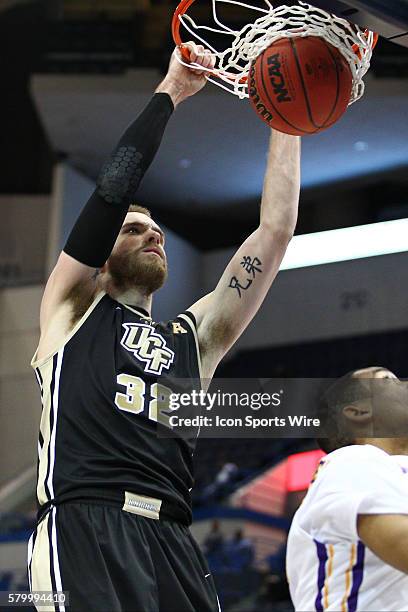 University of Central Florida's Forward Kasey Wilson dunks the ball during the American Athletic Conference men's championship first round game...
