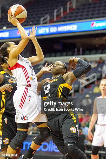 Washington Mystics Armintie Herrington shoots over Tulsa Shock Karima Christmas during the WNBA game between Tulsa Shock versus Washington Mystics at...