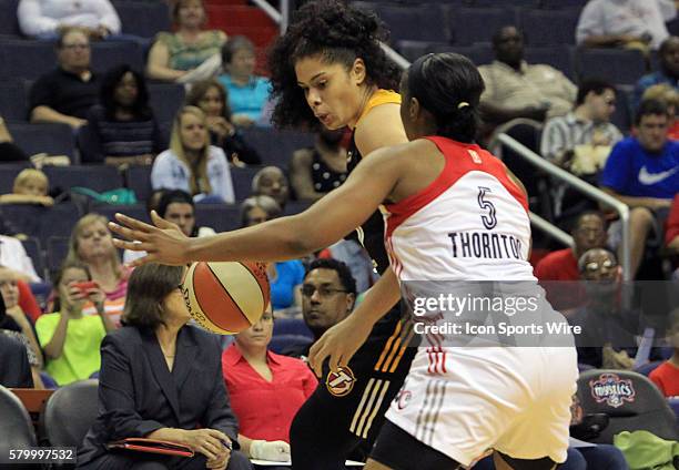 Amanda Zahui B of the Tulsa Shock presses in on Kayla Thornton of the Washington Mystics during a WNBA game at Verizon Center, in Washington D.C....