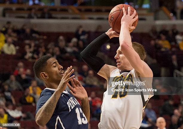 Penn State's Geno Thorpe defends Iowa's Mike Gesell during the Big Ten Men's Basketball Tournament game between the Penn State Nittany Lions and the...