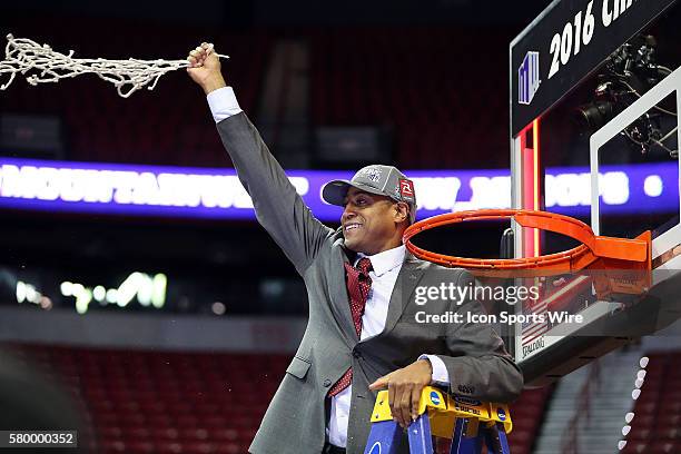 Fresno State Bulldogs head coach Rodney Terry cuts down part of the net after winning the Mountain West College Basketball tournament championship...