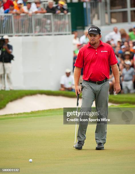 Holmes eyes his shot on the 18th green during the Final Round of the PGA - World Golf Championships-Cadillac Championship at Trump National Doral, in...