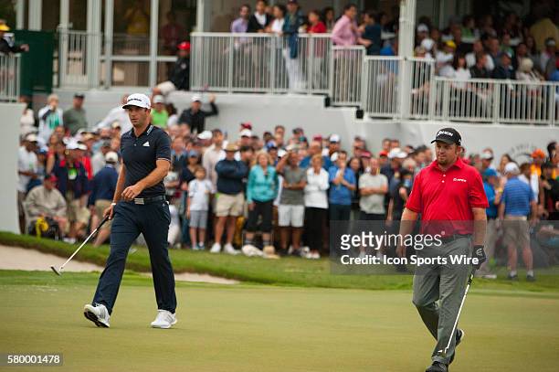 Dustin Johnson, J.B. Holmes on the 18th green during the Final Round of the PGA - World Golf Championships-Cadillac Championship at Trump National...