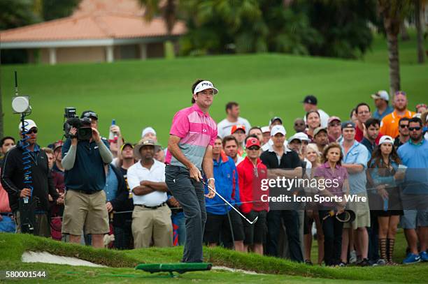 Bubba Watson strokes his 2nd ball at the 16th green during the Final Round of the PGA - World Golf Championships-Cadillac Championship at Trump...