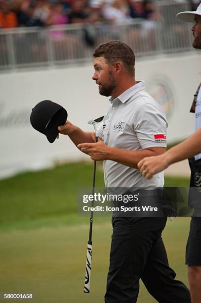 Ryan Moore finishes up his final round on the 18th green during the Final Round of the PGA - World Golf Championships-Cadillac Championship at Trump...