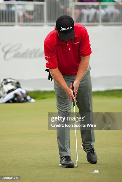 Holmes finishes up on the 18th green during the Final Round of the PGA - World Golf Championships-Cadillac Championship at Trump National Doral, in...