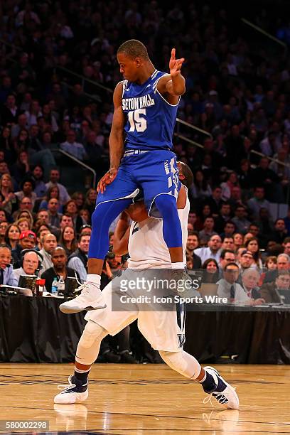 Seton Hall Pirates guard Isaiah Whitehead jumps up and into Villanova Wildcats forward Kris Jenkins during the first half of the Big East Tournament...