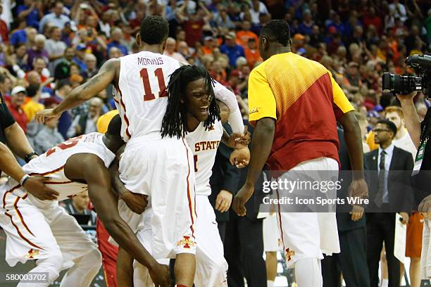 Iowa State guard Monte Morris celebrates with teammates after he scores the winning basket during the Thursday game between Iowa State and Texas in...