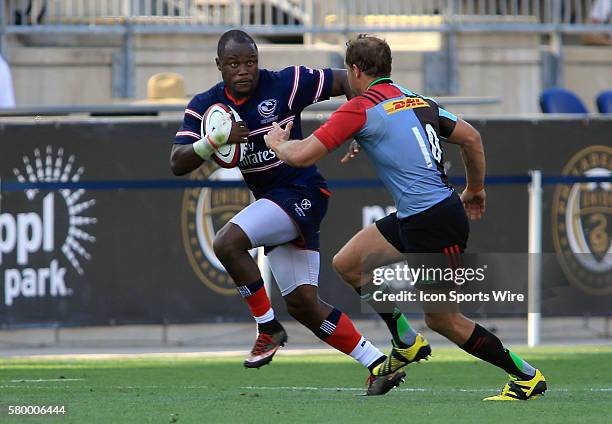 Takudzwa Ngwenya of the USA Eagles races away from Nick Evans of Harlequins during an international rugby friendly match at PPL Park, in Chester, PA....