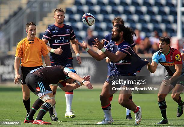 Thretton Palamo of the USA Eagles is held by Tito Tebaldi of Harlequins during an international rugby friendly match at PPL Park, in Chester, PA....