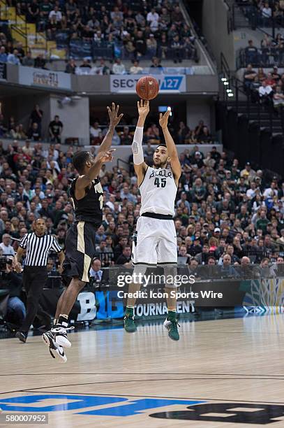 Michigan State Spartans guard Denzel Valentine shoots a three pointer over Purdue Boilermakers guard Rapheal Davis during the men's Big Ten...