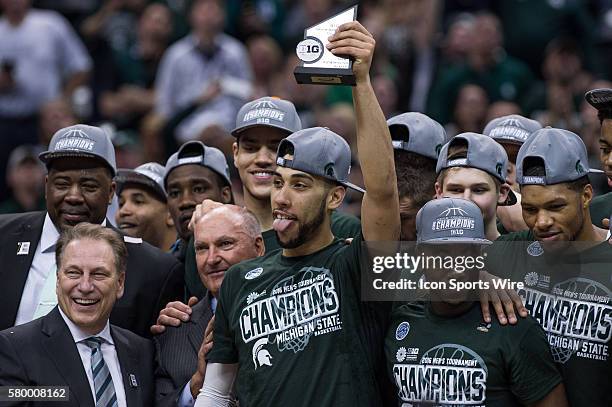 Michigan State Spartans guard Denzel Valentine hold the MVP trophy after winning the men's Big Ten Tournament Championship game between the Purdue...