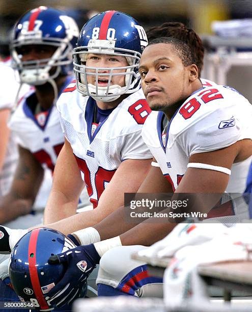 Giants Jeremy Shockey and Visanthe Shiancoe looking dejected on the bench of a NFL football game between the Balitmore Ravens and the New York...