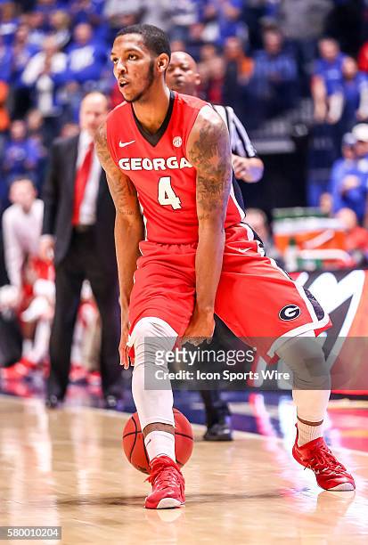 Georgia Bulldogs guard Charles Mann brings the ball up court during the SEC Basketball Championship Tournament semi-final game 2 between Kentucky and...