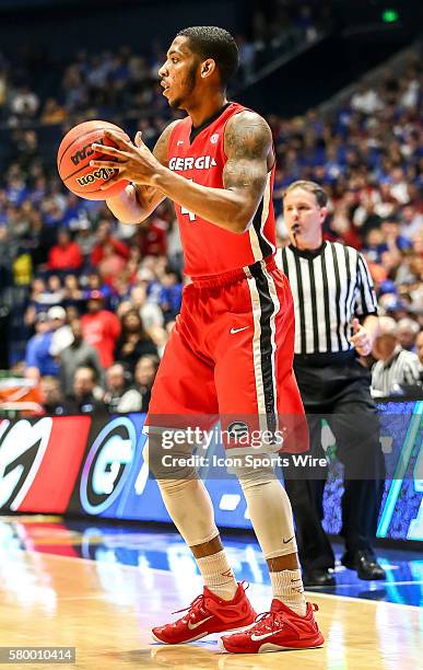 Georgia Bulldogs guard Kenny Gaines looks to pass the ball during the SEC Basketball Championship Tournament semi-final game 2 between Kentucky and...