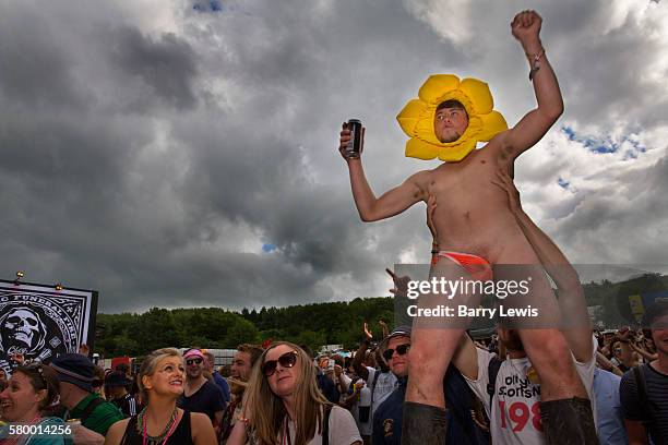 Boy in a flower costume and a mankini dancing to Craig Charles on the Hell Stage, Shangri La field, Glastonbury Festival 2016. The Glastonbury...