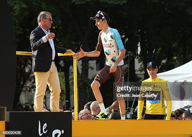 Bernard Hinault greets Romain Bardet of France and AG2R La Mondiale and Chris Froome of Great Britain and Team Sky on the podium following stage 21,...