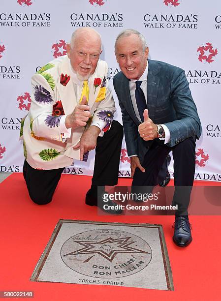 Canadian hockey commentator's Don Cherry and Ron MacLean attend the Canada's Walk Of Fame Star Unveiling at David Pecaut Square on July 25, 2016 in...