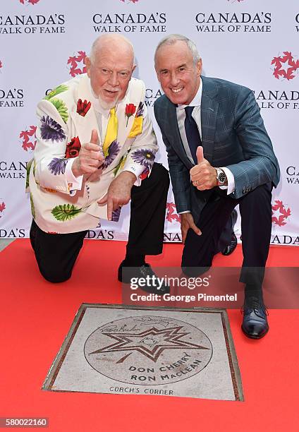 Canadian hockey commentator's Don Cherry and Ron MacLean attend the Canada's Walk Of Fame Star Unveiling at David Pecaut Square on July 25, 2016 in...