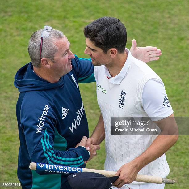 Paul Bracewell and Alastair Cook celebrate the England victory on day four of the 2nd Investec Test match between England and Pakistan at The...