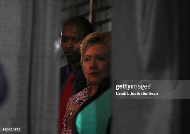 Democratic presidential candidate Hillary Clinton waits backstage before speaking at a Democratic Party organizing event on July 25, 2016 in...