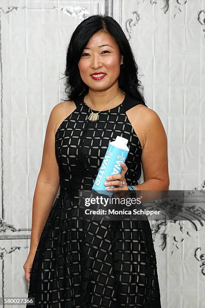 At JUST Goods Grace Jeon poses for a photo with a bottle of JUST Water when she visits AOL HQ for AOL Build Presents JUST Goods, Inc. CEO Grace Jeon...