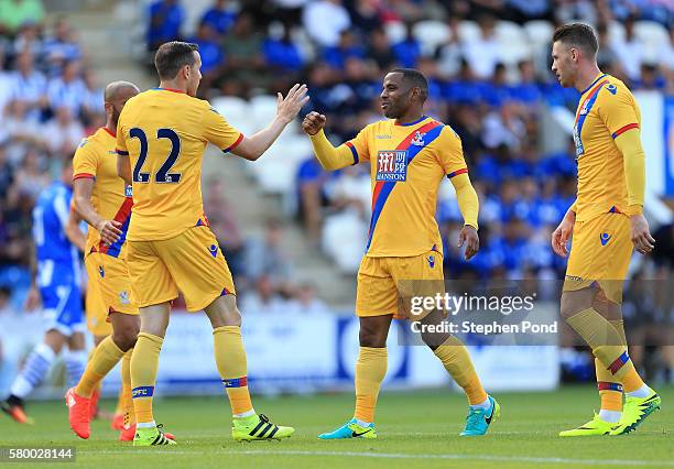 Jordon Mutch of Crystal Palace celebrates his opening goal with Jason Puncheon during the Pre-Season Friendly match between Colchester United and...